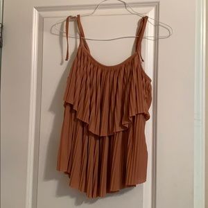 Tan pleated multi-layer tank